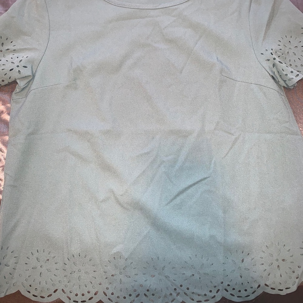 Green shirt with flower cut outs